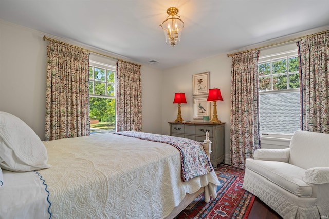 bedroom with a notable chandelier