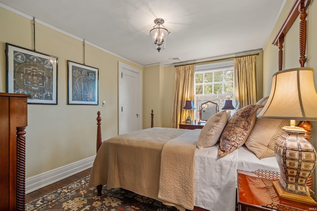 bedroom with wood-type flooring and ornamental molding