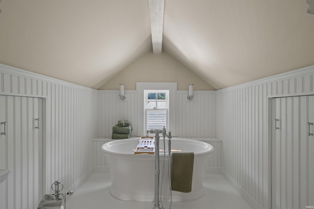 bathroom with a bath, tile patterned floors, and vaulted ceiling with beams