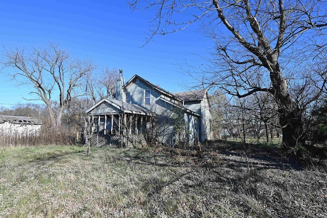 view of front of house with a sunroom