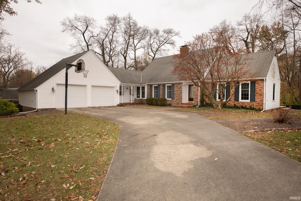 view of front facade with a front lawn and a garage