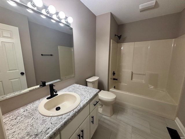 full bathroom with toilet, tub / shower combination, and vanity