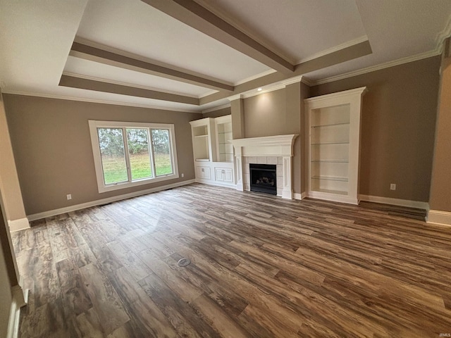 unfurnished living room with a raised ceiling, a tiled fireplace, dark wood-type flooring, and crown molding