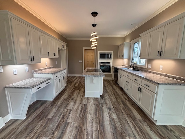 kitchen with a kitchen island, appliances with stainless steel finishes, sink, white cabinets, and dark wood-type flooring