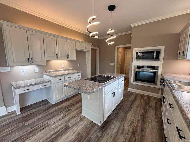 kitchen featuring white cabinets, stainless steel appliances, decorative light fixtures, and dark hardwood / wood-style flooring