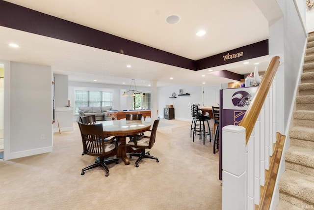 dining space with light colored carpet