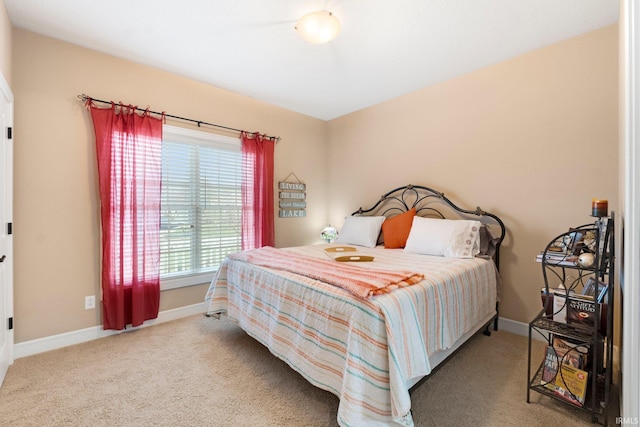 bedroom featuring light colored carpet