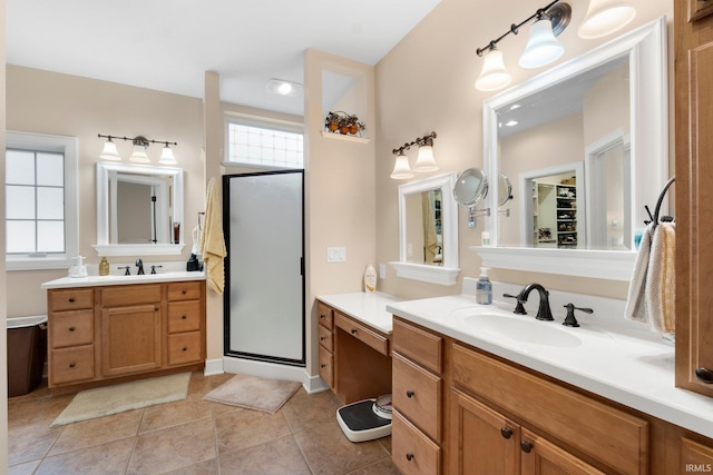 135 Ln 335 Lake James Ln, Angola, IN 46703 - bathroom with a shower stall, two vanities, and tile patterned flooring