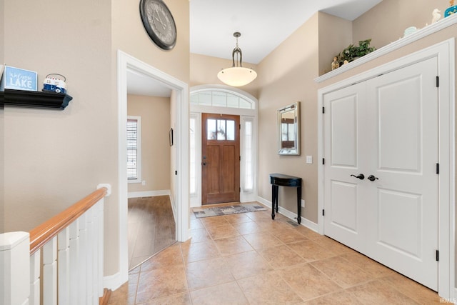 foyer entrance featuring light tile patterned flooring