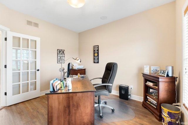 office area with hardwood / wood-style flooring