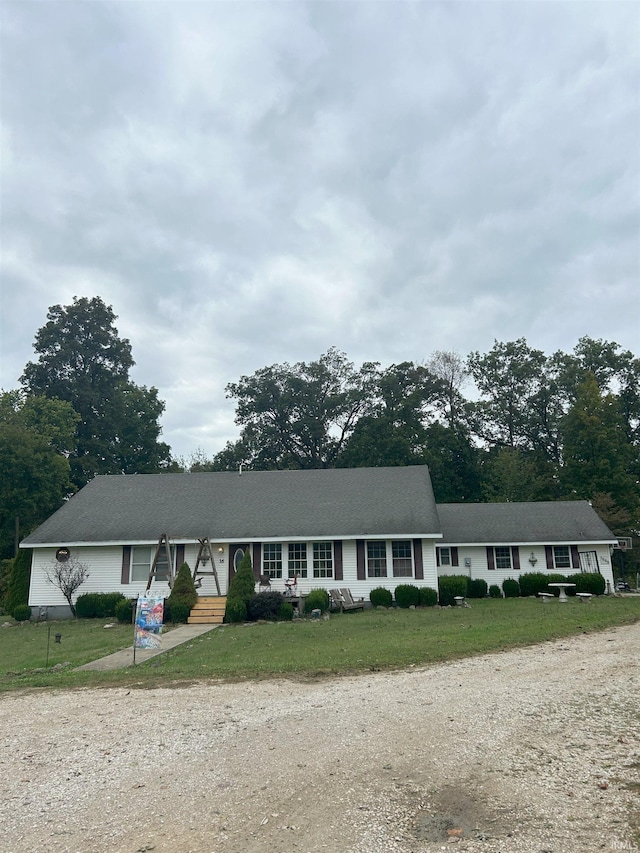 ranch-style house with a front yard