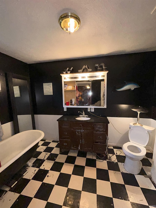 bathroom with vanity and a tub to relax in