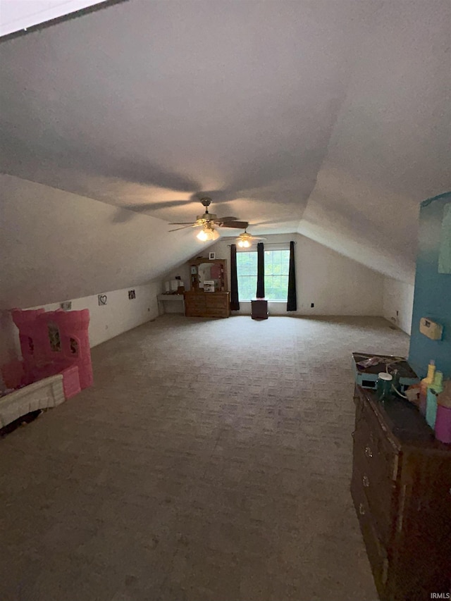 bonus room featuring carpet flooring, lofted ceiling, and ceiling fan