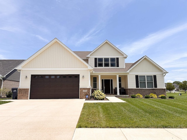 craftsman-style house featuring a garage, a front lawn, and covered porch