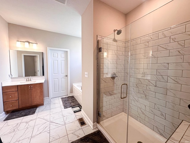 bathroom with independent shower and bath and vanity