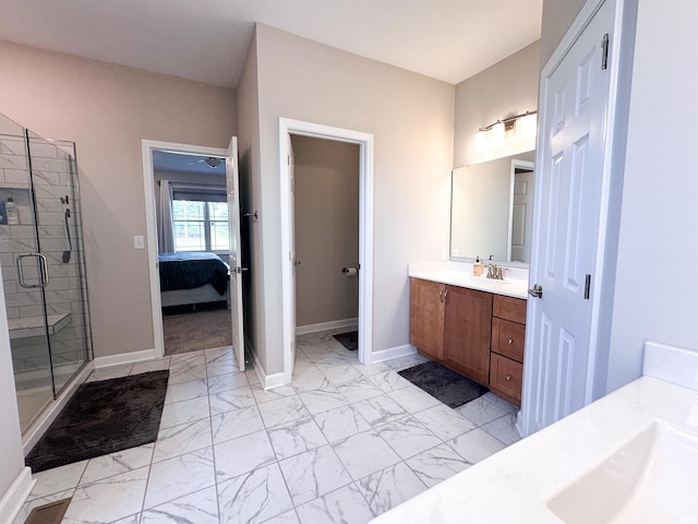 bathroom featuring vanity and a shower with door