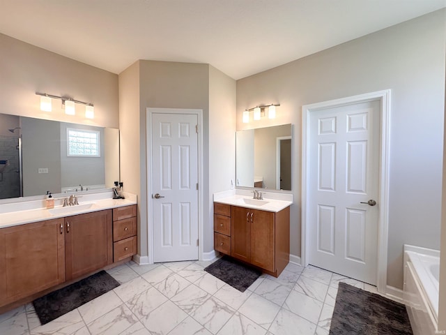 bathroom with a tub to relax in and vanity