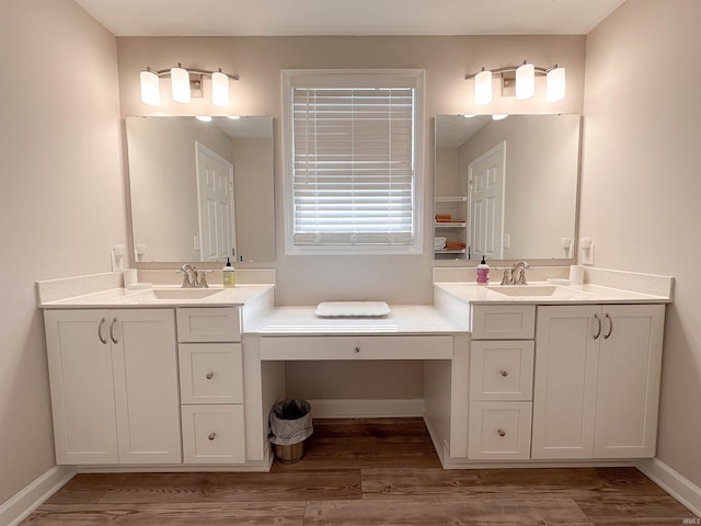 bathroom with hardwood / wood-style floors and vanity