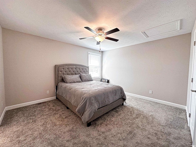 bedroom with ceiling fan, a textured ceiling, and carpet floors