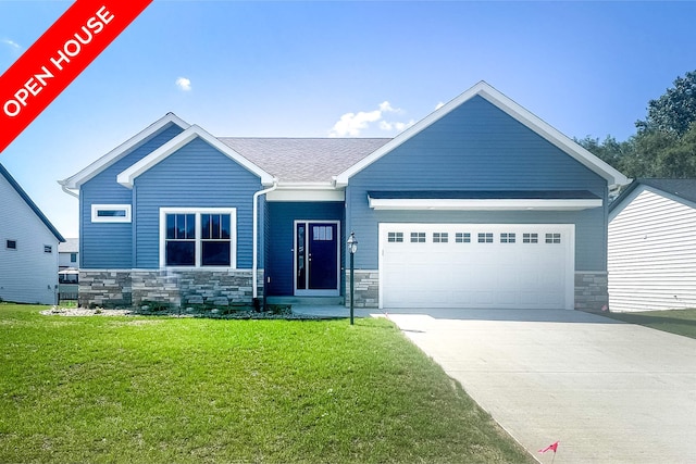 craftsman-style home with a garage and a front yard