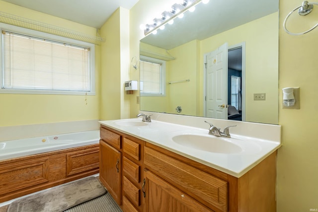 bathroom with a tub to relax in and vanity