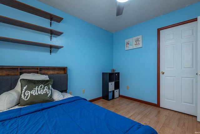 bedroom featuring light wood-type flooring and ceiling fan