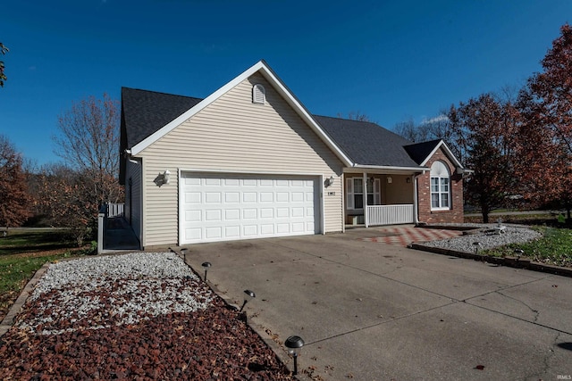 view of front of home featuring a garage and covered porch