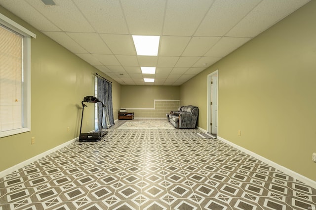 exercise room with a drop ceiling