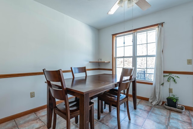 dining space featuring ceiling fan and light tile patterned floors