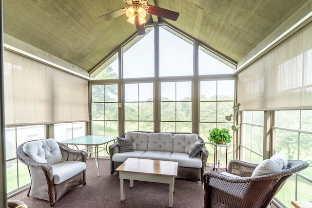 sunroom / solarium with ceiling fan, a healthy amount of sunlight, and lofted ceiling