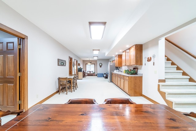 dining space with light colored carpet