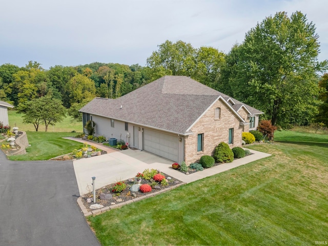 view of front of property featuring a garage and a front yard