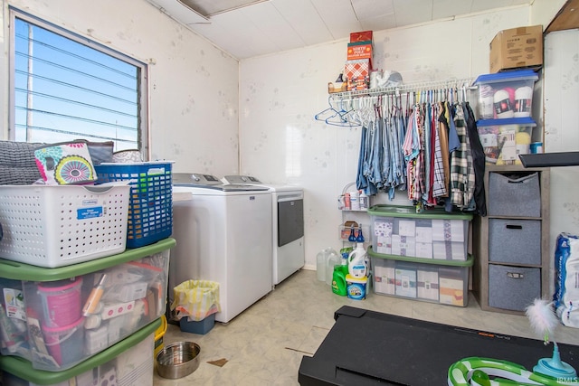 laundry area with washing machine and clothes dryer