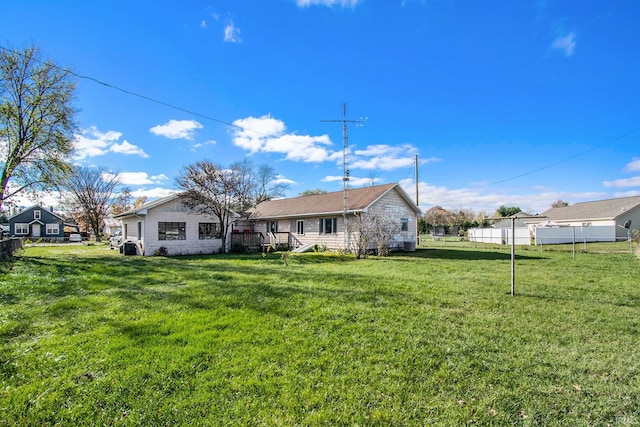 back of house with a yard