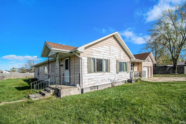 view of property exterior featuring a garage and a yard