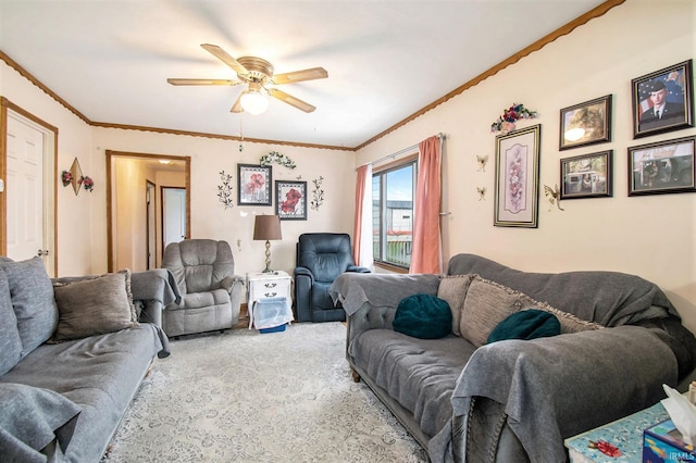 carpeted living room featuring ceiling fan and ornamental molding