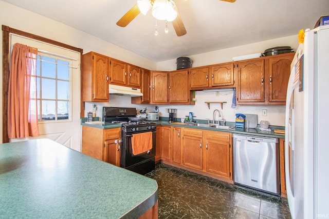 kitchen featuring white refrigerator, black gas range, dishwasher, sink, and ceiling fan