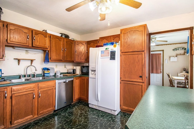 kitchen with white fridge with ice dispenser, stainless steel dishwasher, sink, and ceiling fan