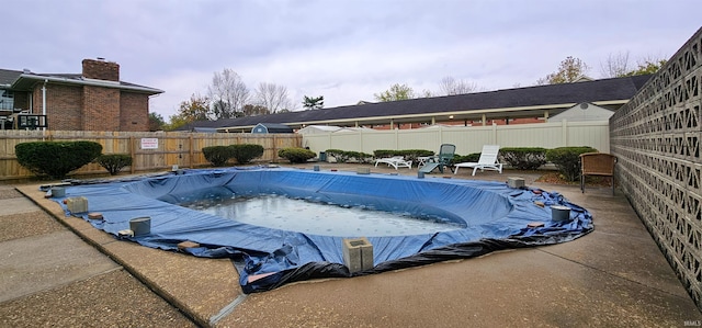 view of pool featuring a patio