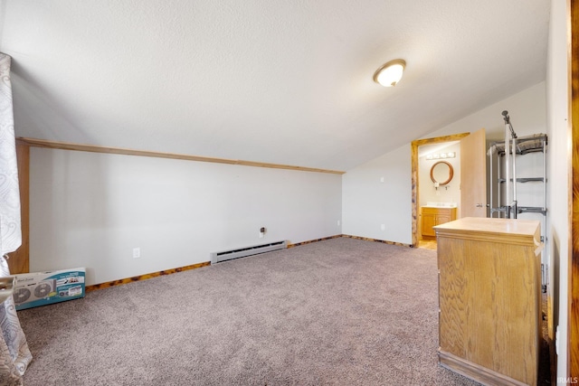 additional living space featuring baseboard heating, lofted ceiling, a textured ceiling, and carpet floors