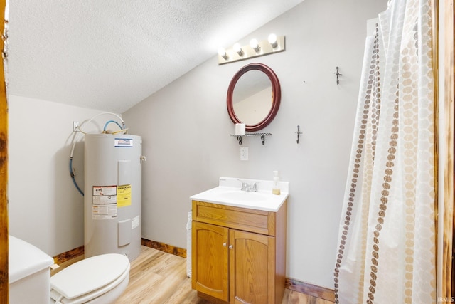 bathroom with a textured ceiling, hardwood / wood-style floors, vanity, lofted ceiling, and electric water heater