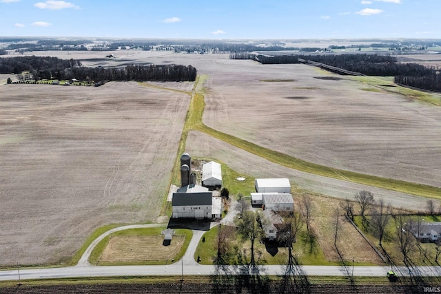 birds eye view of property with a rural view