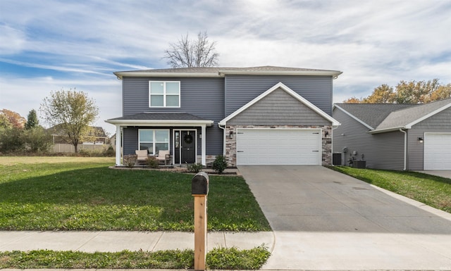 view of front of home with a front yard and a garage