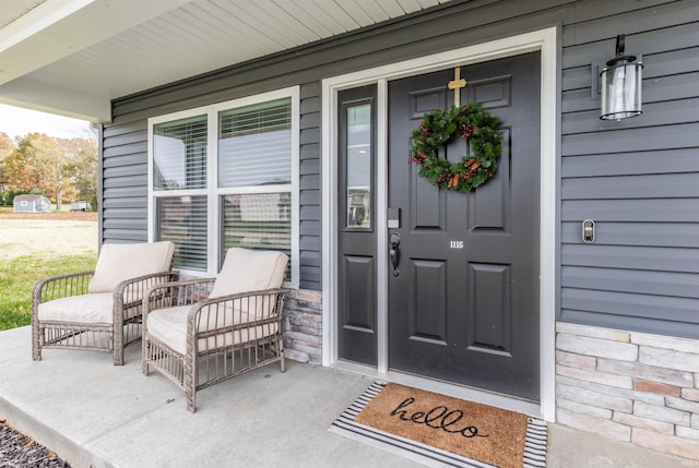 entrance to property featuring covered porch