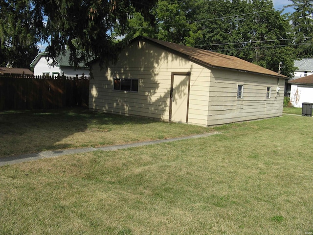 view of outbuilding with a yard