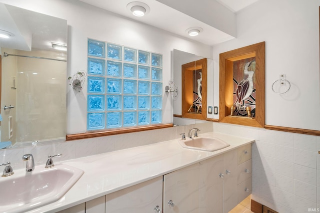 bathroom featuring tile walls, vanity, and tile patterned flooring