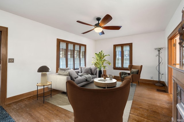 living room with ceiling fan and wood-type flooring