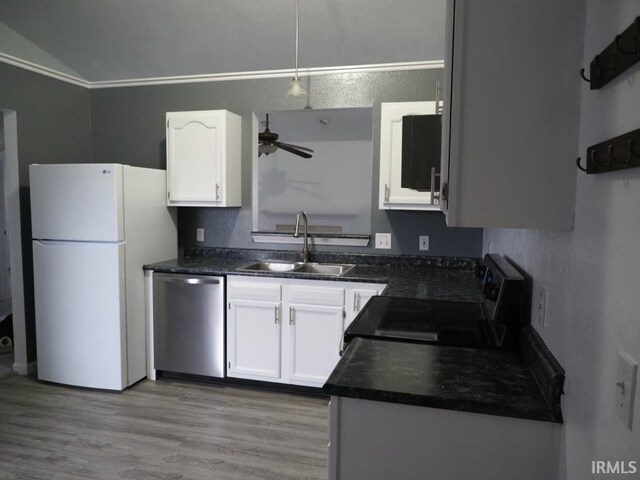 kitchen with white fridge, white cabinetry, light wood-type flooring, sink, and dishwasher