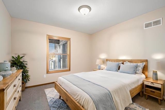 bedroom featuring light colored carpet