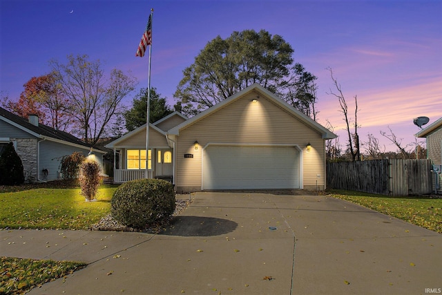 single story home with a yard and a garage